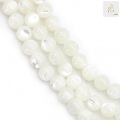 Close-up view of white mother of pearl shell round beads showing lustrous natural finish and consistent 4mm size