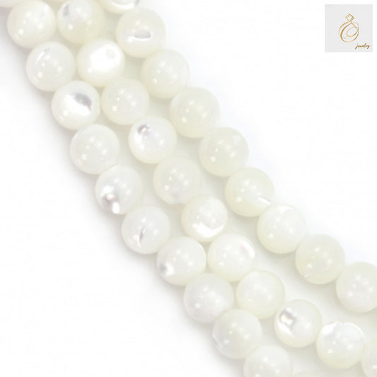 Close-up view of white mother of pearl shell round beads showing lustrous natural finish and consistent 4mm size