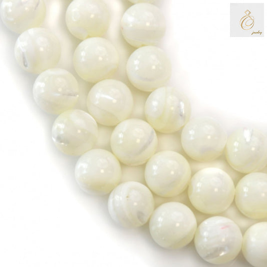 Close-up view of 10mm white shell mother of pearl beads with 1mm holes for jewelry making