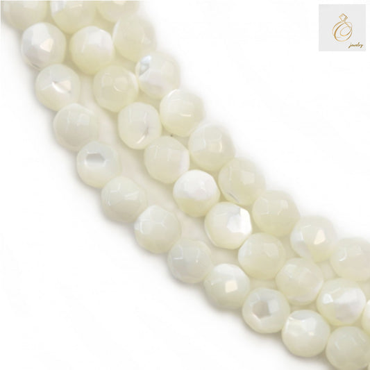 Close-up view of 4mm white mother of pearl faceted round beads showing natural iridescent surface texture