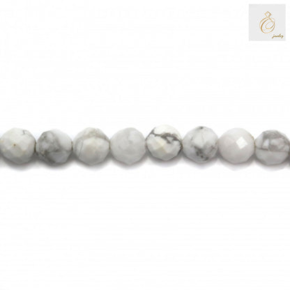 Close-up of 3mm white howlite faceted round beads showing texture and quality
