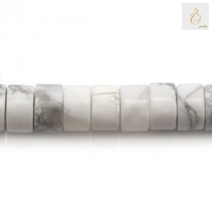 Close-up of white howlite gemstone beads showing 2x4mm heishi shape and texture