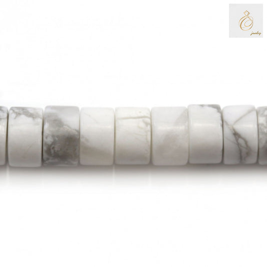 Close-up of white howlite gemstone beads showing 2x4mm heishi shape and texture