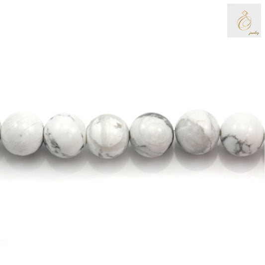 Close-up view of white howlite round beads showing 1.2mm holes"
"White howlite beads texture detail with natural gray veining"
"Size comparison of 10mm white howlite round beads