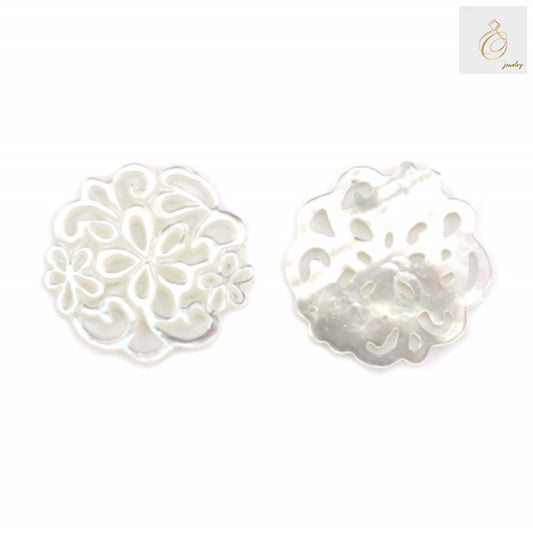 Close-up view of white mother-of-pearl shell charm showing detailed hollow floral pattern, 18mm size