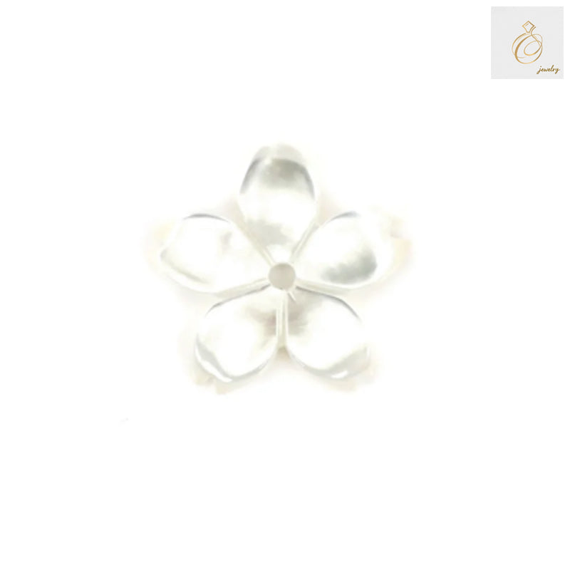 Close-up view of white mother-of-pearl flower beads displaying natural luster and detailed flower pattern, perfect for craft projects