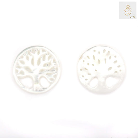 Close-up view of white mother-of-pearl Tree of Life charm showing natural shell texture and detailed carving