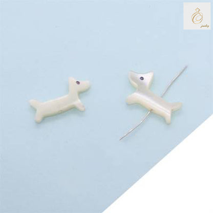 Close-up view of white shell mother-of-pearl dog beads showing natural luster and 9x14mm size