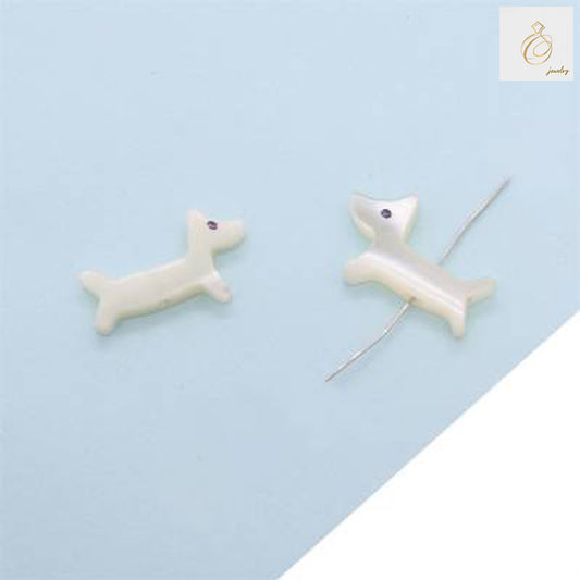 Close-up view of white shell mother-of-pearl dog beads showing natural luster and 9x14mm size