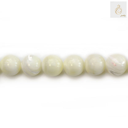 White mother of pearl round beads strand 10mm diameter showing lustrous finish and natural variations