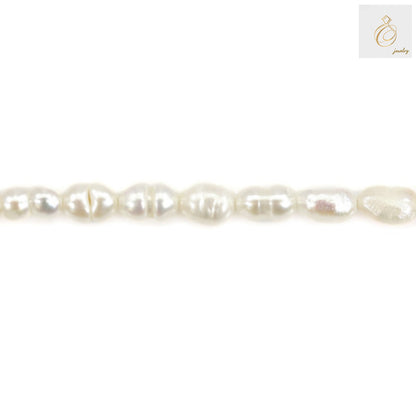 Close-up view of white freshwater pearl showing lustrous surface and oval shape"
"Individual 3-4mm white cultured pearls displaying natural variations