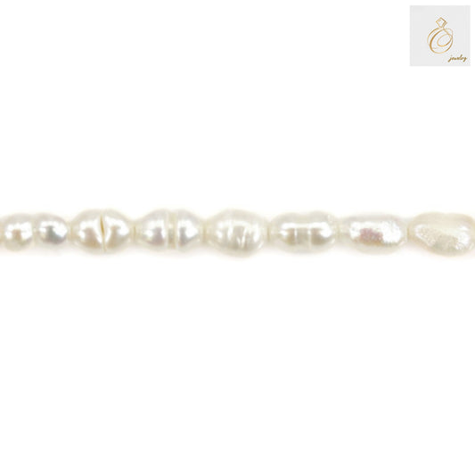 Close-up view of white freshwater pearl showing lustrous surface and oval shape"
"Individual 3-4mm white cultured pearls displaying natural variations