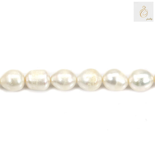 White oval freshwater pearls close-up detail 8-9mm size showing natural surface texture