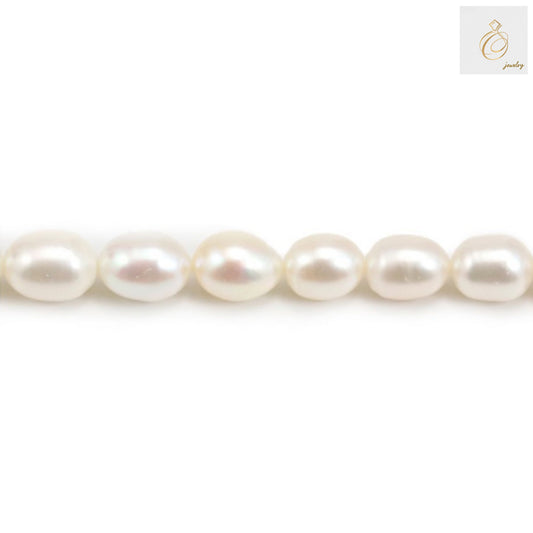 White freshwater cultured pearl strand with oval 9-10mm pearls, 39-40cm length"
"Premium white oval freshwater pearls arranged in strand for jewelry making"
"Close-up of lustrous white cultured pearls showing natural nacre and oval shape