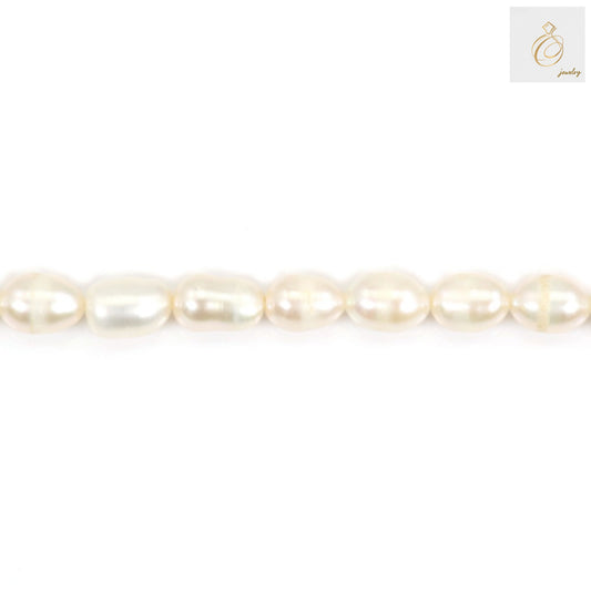 White freshwater cultured pearl strand with oval 5-6mm pearls"
"Natural white pearls arranged in 39-40cm strand for jewelry making"
"Close-up of lustrous white freshwater cultured pearls, oval shape"
"Premium quality white pearl strand showing natural luster and texture