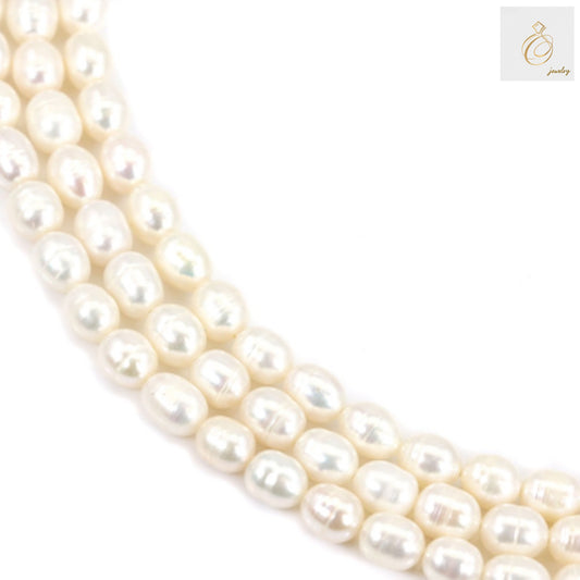 White freshwater cultured pearl strand, 6-7mm oval pearls, 39-40cm length, displayed on white background